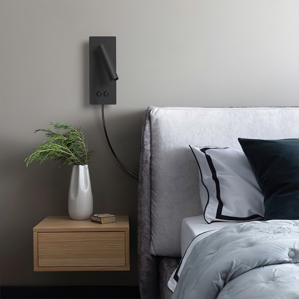 Surface-mount wall reading light seen from a side angle
