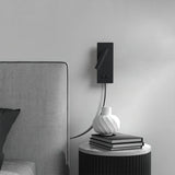 Bedside wall light with spotlight and separate backlight lit
