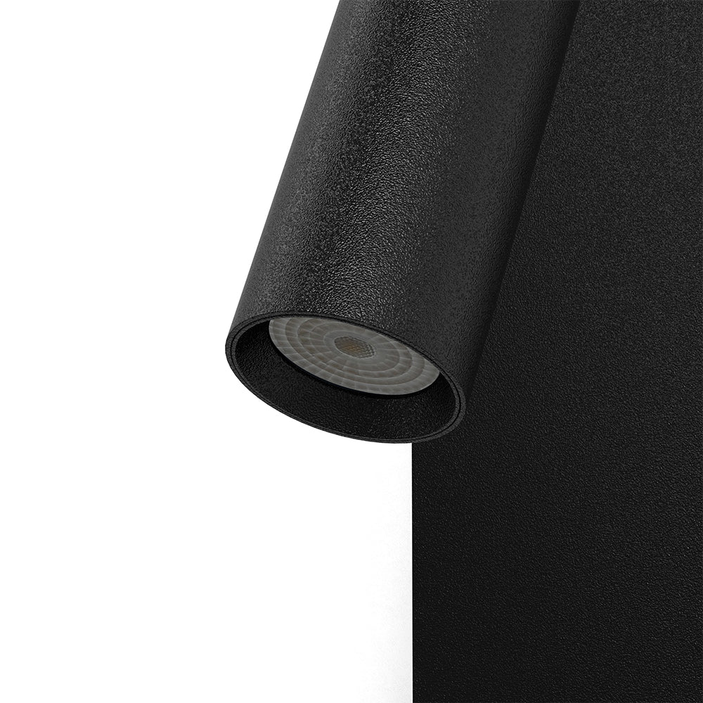 Plug-in wall reading light with visible cord to a socket
