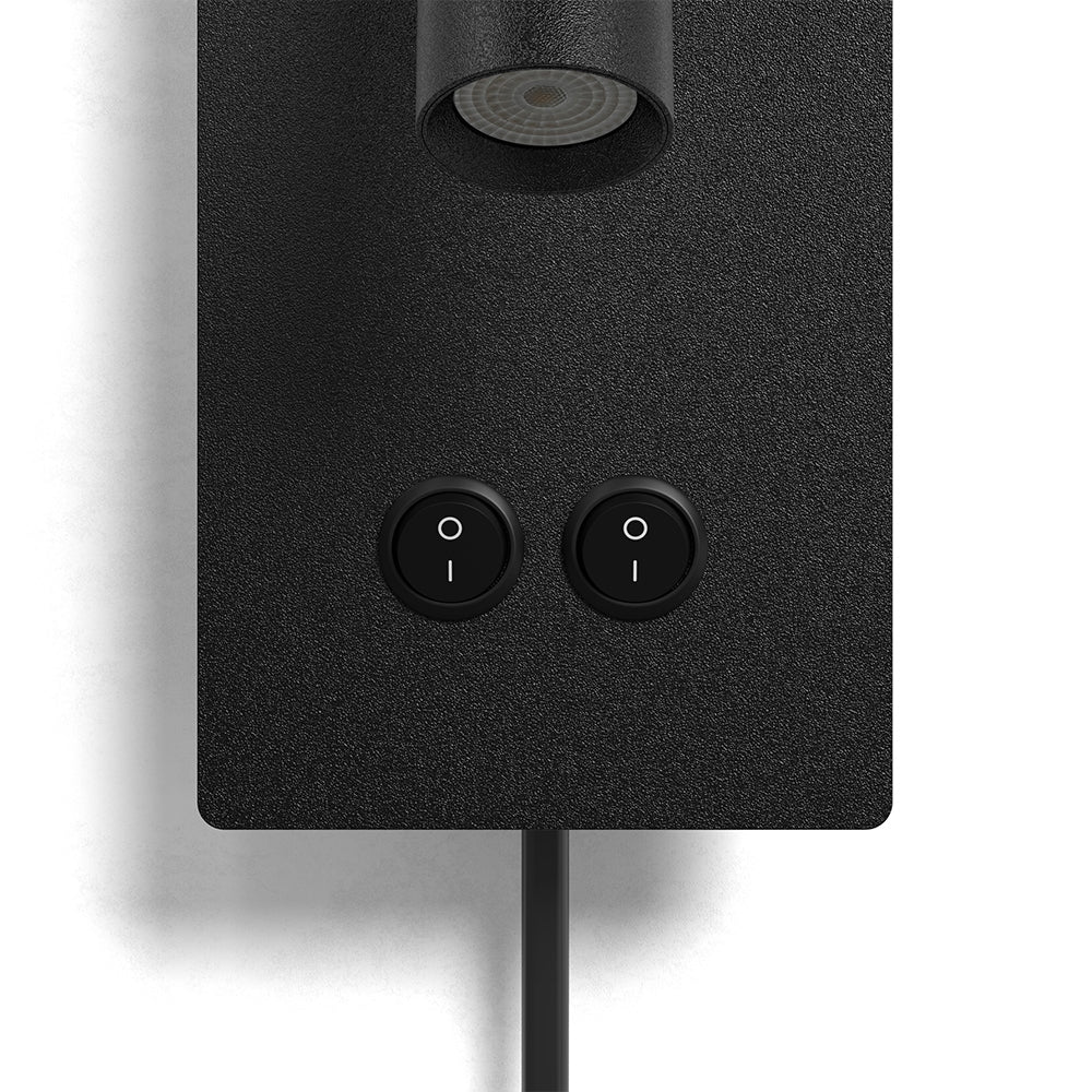 Wall light head angled up toward a headboard reading position