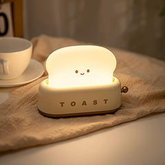 Pink toaster table lamp with warm LED toast shade
