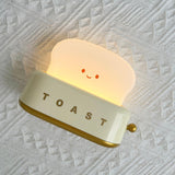 Close view of the toaster lamp toggle switch and body
