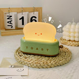Toaster table lamp side view with brass lever knob