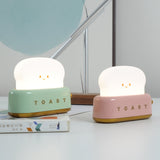 Three toaster table lamps in green pink and yellow