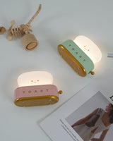 Retro toaster accent lamp on a wooden shelf