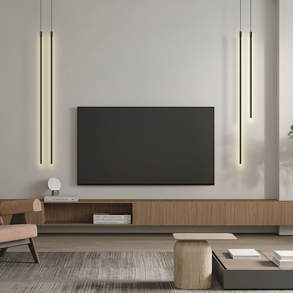 Black minimalist tube pendant light against a neutral backdrop