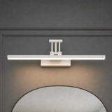 Black LED vanity wall light mounted above a bathroom mirror