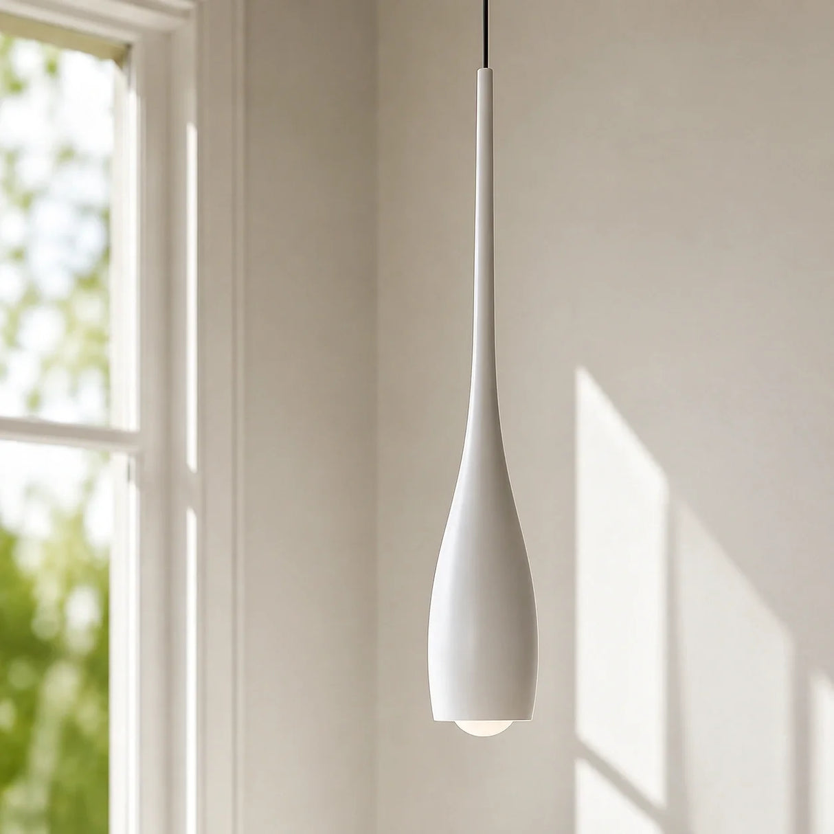 Black water drop pendant light shown as a single hanging fixture