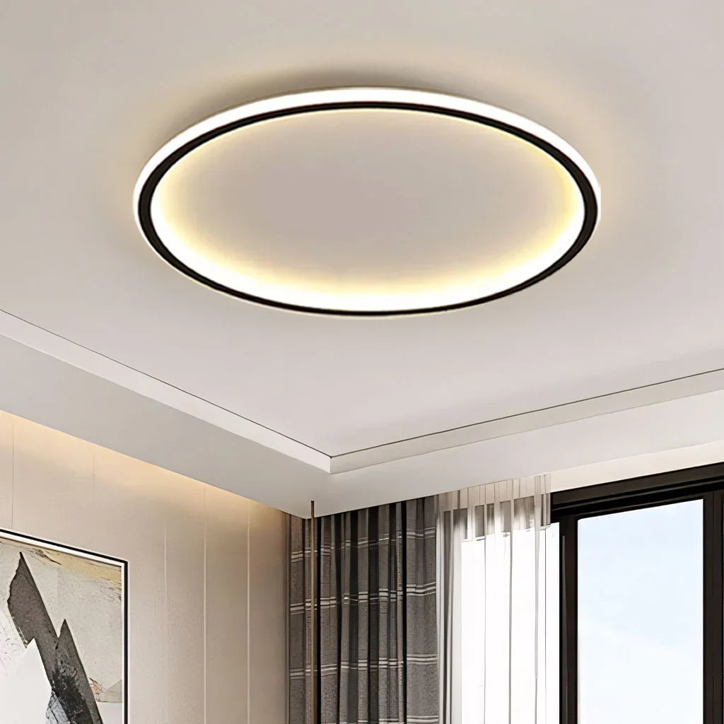Black round LED flush mount ceiling light close up on ceiling