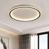 Black round LED flush mount ceiling light close up on ceiling