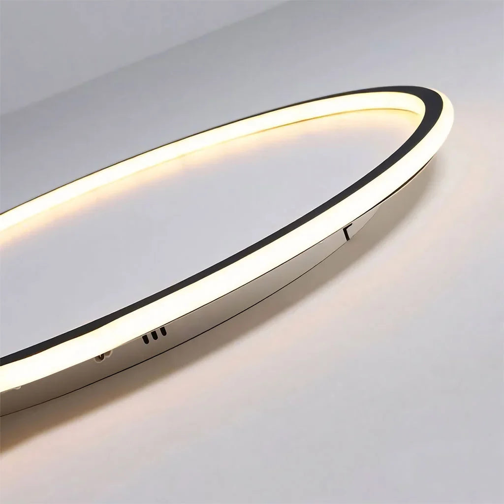 Close detail of the round ceiling light lit acrylic diffuser edge