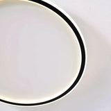 Detail of the slim metal ring frame on the round ceiling light
