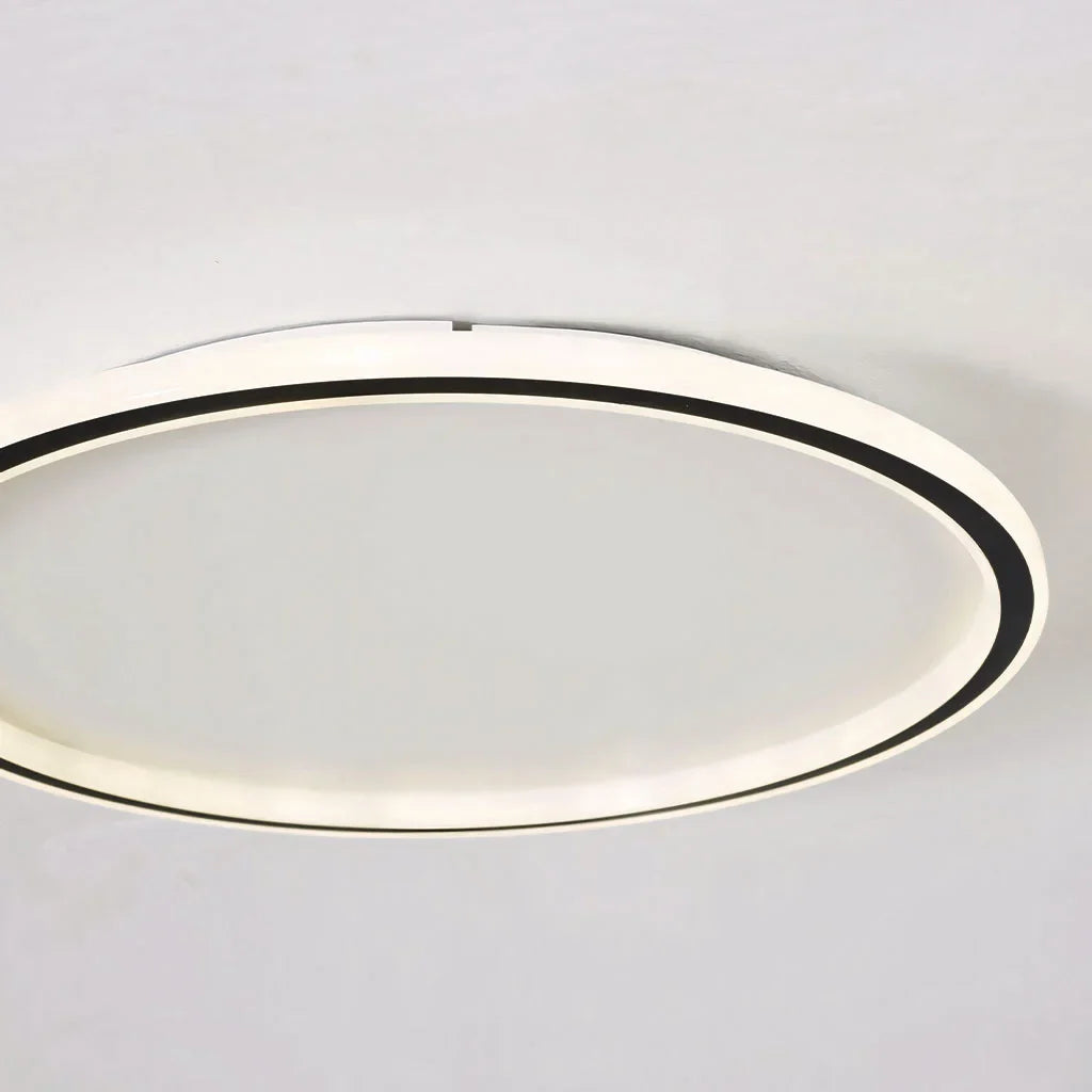 Close view of the round ceiling light rim showing even LED illumination
