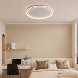 White round ceiling light illuminating a modern minimalist bedroom