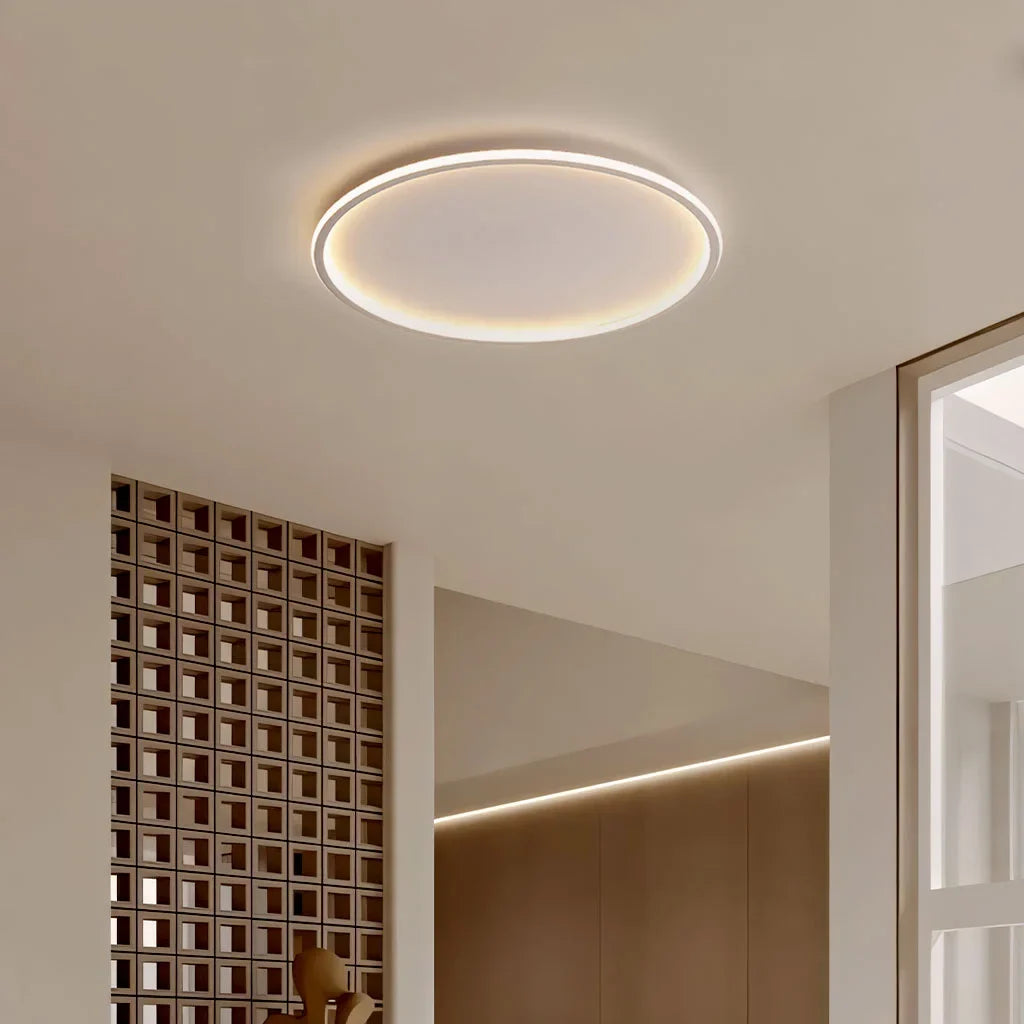 White round ceiling light lighting a bright hallway corridor