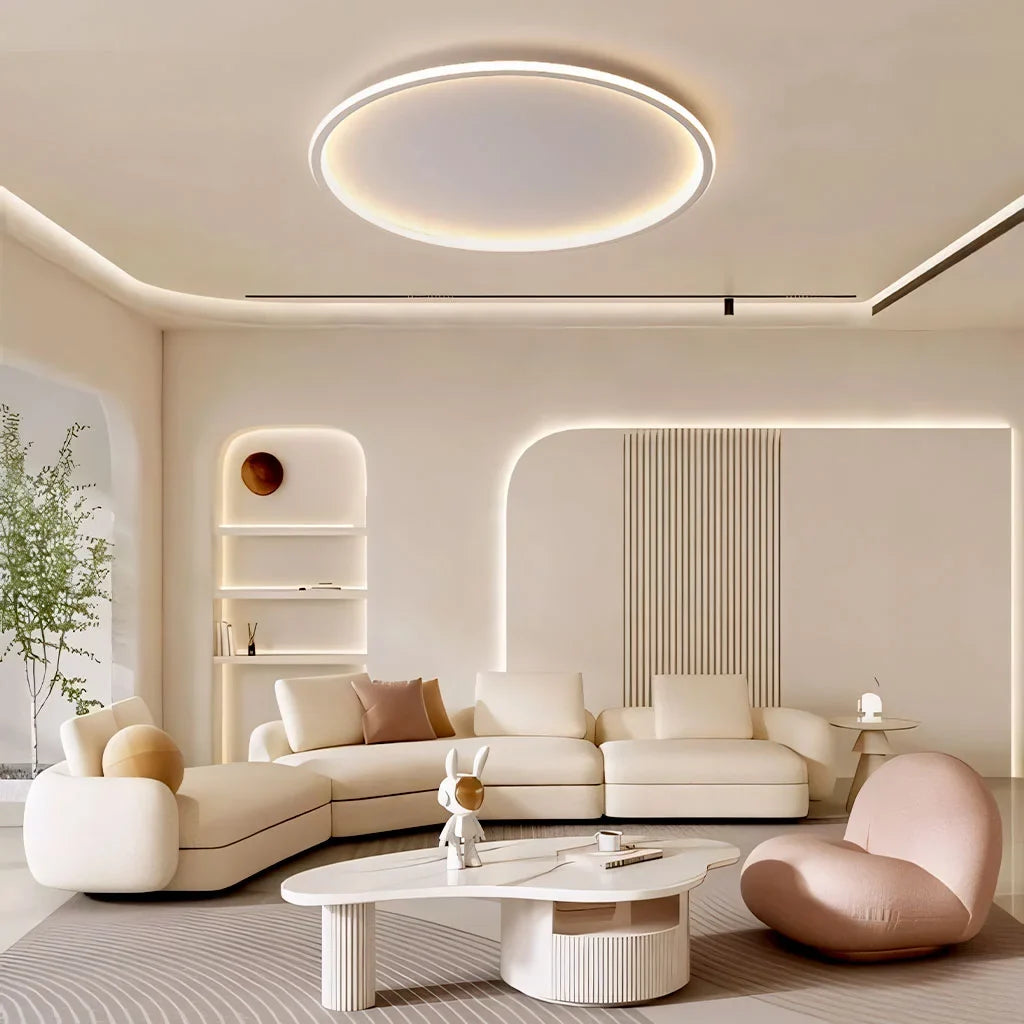 White round LED ceiling light glowing above a contemporary living room