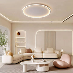 White round LED ceiling light glowing above a contemporary living room