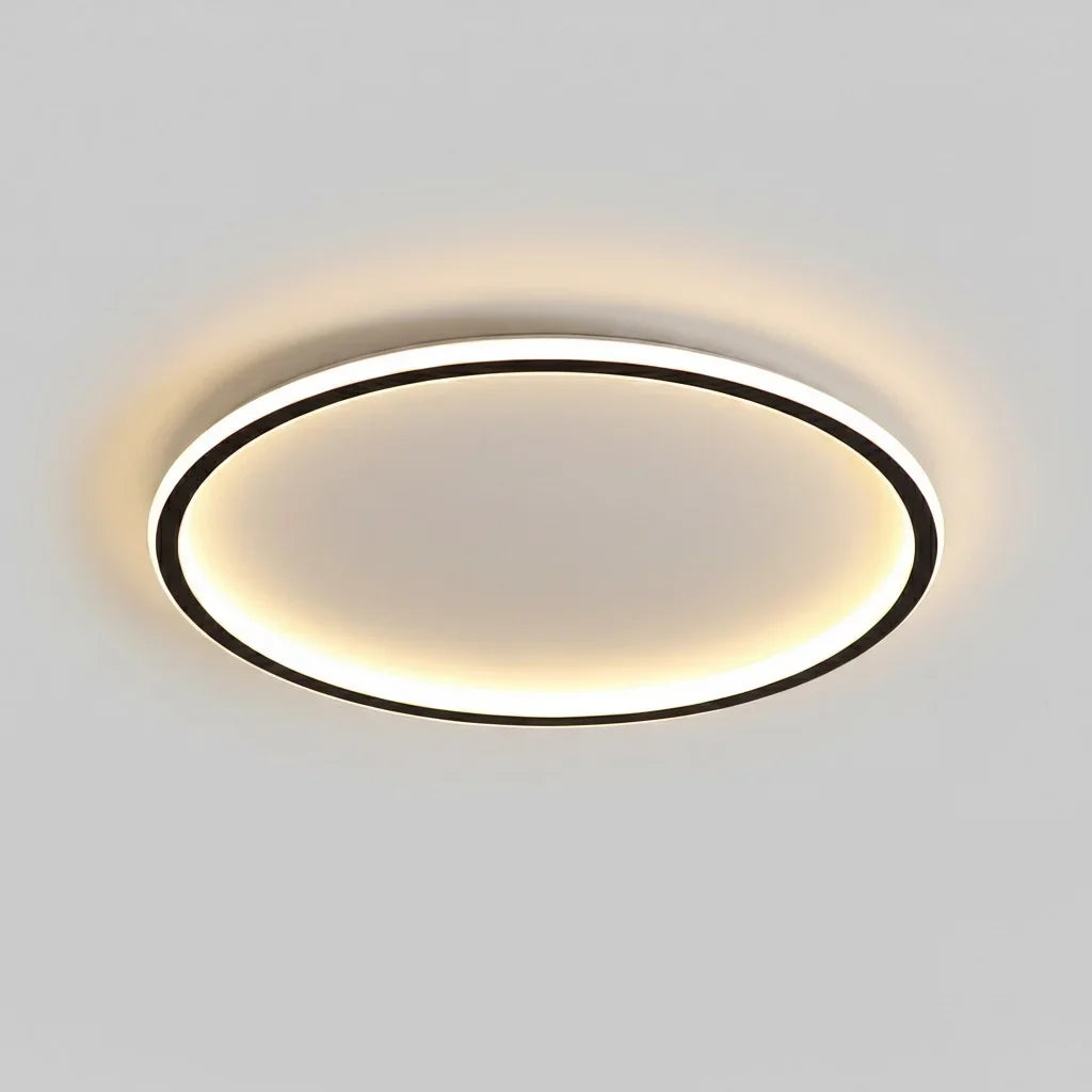 Round LED flush mount ceiling light shown against a plain ceiling