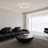 Slim round ceiling light with warm integrated LED glow around the rim