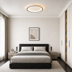 Round flush mount ceiling fixture viewed at an angle showing thin profile