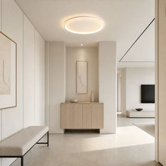 Circular LED ceiling light casting an even glow across its acrylic face