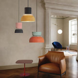 Four colorful pendant lights in a classical style room
