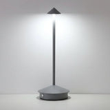 Cordless dimmable table lamp casting a soft downward pool of light