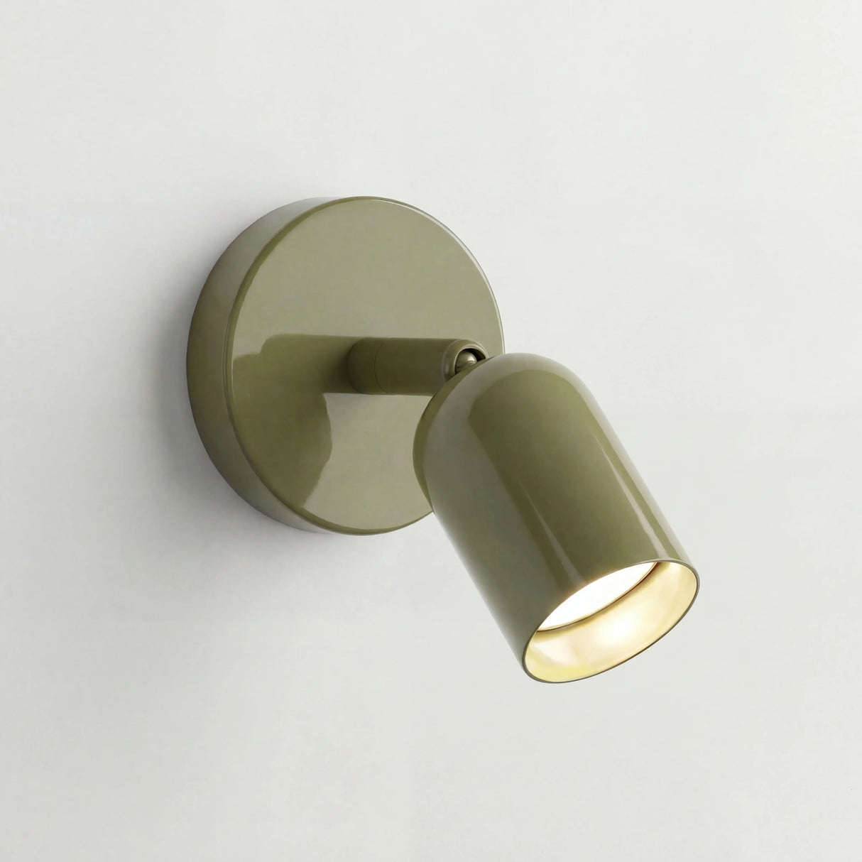 Studio product shot of the frosted metal wall sconce with rotatable shade