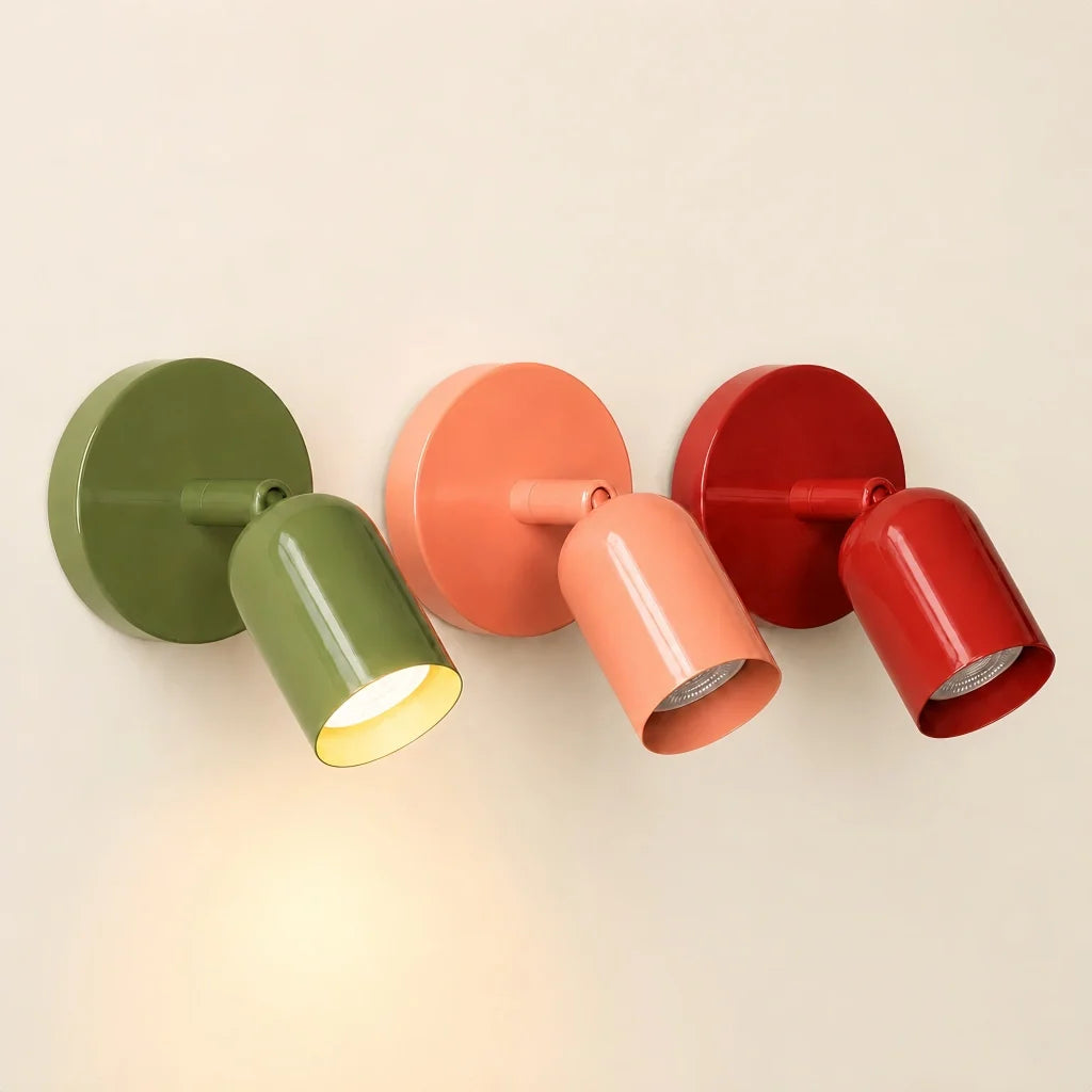 Side profile of the adjustable wall sconce showing the tilting cylindrical shade