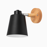 Black sconce shown in profile against a plain white background