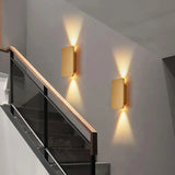 Front view of the brushed gold rectangular wall sconce