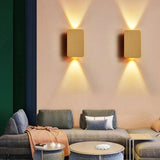 Gold rectangular LED wall sconce studio product photo