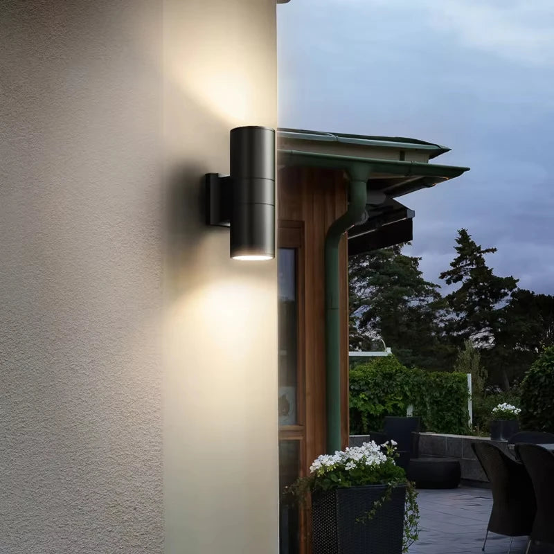 Close-up of aluminum outdoor wall lamp showing sand black textured finish