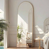Arc floor length mirror with gold frame in modern interior