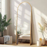 Arched full length wall mirror mounted in bright hallway