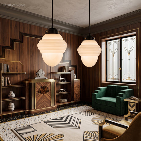 Two stepped milk glass pendants in a walnut panelled art deco lounge
