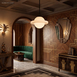 Saturn profile milk glass pendant lighting an arched art deco hallway