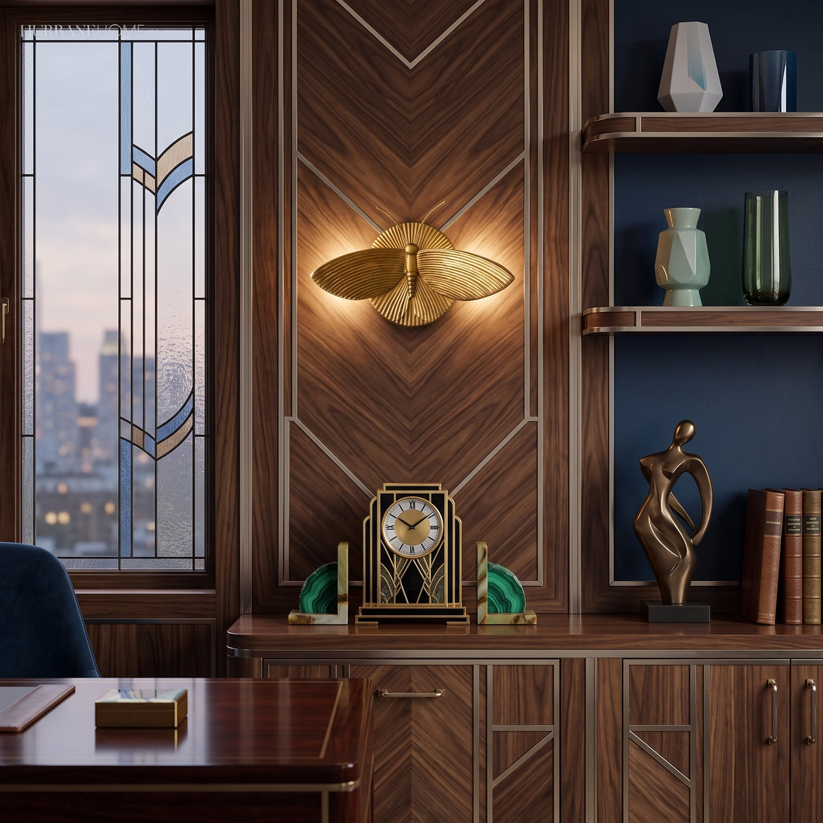 Winged moth wall light above a walnut desk in a city apartment study