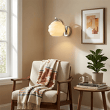 Frosted glass wall sconce with a chrome arm and round plate, view 3