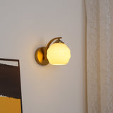 Opal glass globe sconce on a round backplate, gold finish, view 20