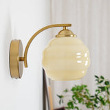Indoor wall sconce with an iron body and opal glass globe, view 24