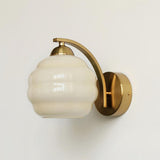 Indoor wall sconce with an iron body and opal glass globe, view 30