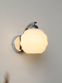 Art Deco opal glass globe wall sconce with a curved metal arm, view 31