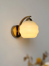 Opal glass globe sconce on a round backplate, gold finish, view 32