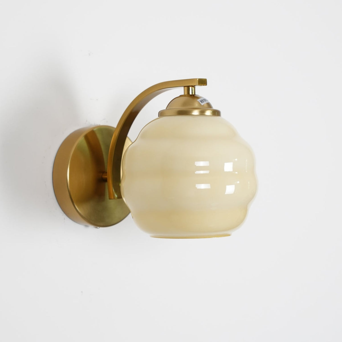 Indoor wall sconce with an iron body and opal glass globe, view 42