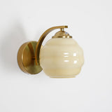 Indoor wall sconce with an iron body and opal glass globe, view 42