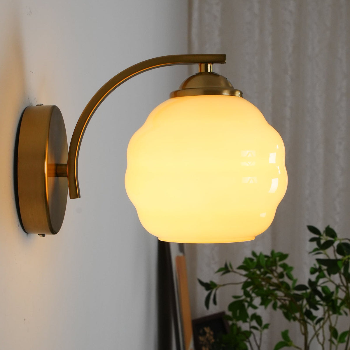 Art Deco opal glass globe wall sconce with a curved metal arm, view 43