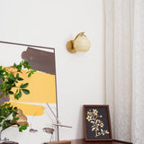 Hardwired E26 glass globe wall sconce in a gold and white finish, view 47