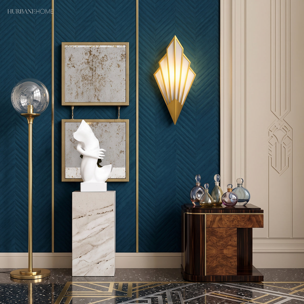 Gold fan sconce lit on a blue wall beside framed artwork