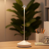Rechargeable table lamp with conical shade and slim aluminum stem